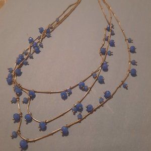 Triple layered blue necklace with adjustable closure